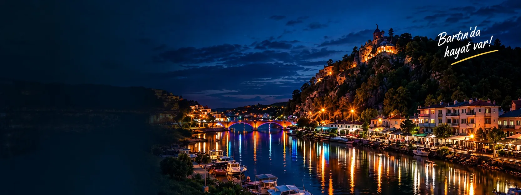 Gece ışıkları yanan Bartın ırmağı, köprü ve tepedeki kale